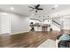 Open concept living area with hardwood floors and kitchen at 1003 Starboard Ct, Oldsmar, FL 34677
