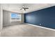 Main bedroom with blue accent wall and lake view at 1003 Starboard Ct, Oldsmar, FL 34677
