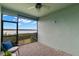 Screened porch with water view and patio furniture at 1003 Starboard Ct, Oldsmar, FL 34677