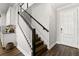 Modern staircase with dark wood and white railings at 1003 Starboard Ct, Oldsmar, FL 34677