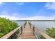 Wooden dock extending into the calm water at 1003 Starboard Ct, Oldsmar, FL 34677