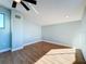 Bright bedroom with hardwood floors and a ceiling fan at 13304 Neptune Dr, Hudson, FL 34667