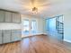 Dining area with kitchen and spiral staircase access at 13304 Neptune Dr, Hudson, FL 34667