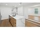 Bright kitchen island features stainless steel appliances and white cabinets at 1741 25Th N Ave, St Petersburg, FL 33713