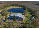Aerial view showing house, pond, and surrounding land at 18409 Tyler Rd, Odessa, FL 33556