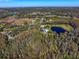 Aerial view of home on large lot with pond at 18409 Tyler Rd, Odessa, FL 33556