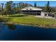 Home with large backyard, patio, and pond view at 18409 Tyler Rd, Odessa, FL 33556