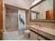 Clean bathroom with tub, shower, vanity, and decorative shower curtain at 18409 Tyler Rd, Odessa, FL 33556