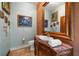 Elegant powder room with marble vanity and ornate mirror at 18409 Tyler Rd, Odessa, FL 33556