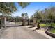 Gated entrance to property with brick columns and landscaping at 18409 Tyler Rd, Odessa, FL 33556