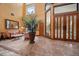 Bright entryway with a sitting area and large windows at 18409 Tyler Rd, Odessa, FL 33556