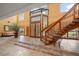Grand entryway with a curved staircase and tiled floors at 18409 Tyler Rd, Odessa, FL 33556