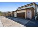 Three-car garage with wood accents and ample parking space at 18409 Tyler Rd, Odessa, FL 33556