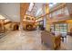 Spacious great room with tile floors and a large dining table at 18409 Tyler Rd, Odessa, FL 33556