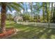 Charming guest house with white picket fence and landscaping at 18409 Tyler Rd, Odessa, FL 33556