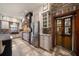 Elegant kitchen with stainless steel appliances and a charming antique door at 18409 Tyler Rd, Odessa, FL 33556