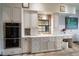 Well-equipped kitchen with double ovens and stylish white cabinetry at 18409 Tyler Rd, Odessa, FL 33556