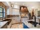 Modern kitchen with farmhouse sink, custom cabinetry, and high-end finishes at 18409 Tyler Rd, Odessa, FL 33556