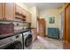 Convenient laundry room with washer, dryer, and ample storage at 18409 Tyler Rd, Odessa, FL 33556