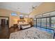 Bright main bedroom with large windows, water views, and hardwood floors at 18409 Tyler Rd, Odessa, FL 33556