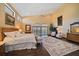 Spacious main bedroom with water views, hardwood floors, and a large bed at 18409 Tyler Rd, Odessa, FL 33556
