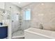 Elegant bathroom with a large walk-in shower and soaking tub at 20001 Gulf Blvd # 501, Indian Shores, FL 33785