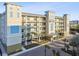 Three-story building exterior with balconies, palm trees, and parking at 20001 Gulf Blvd # 501, Indian Shores, FL 33785