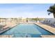 Inviting community pool with lounge chairs and waterfront views at 20001 Gulf Blvd # 501, Indian Shores, FL 33785
