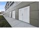 Exterior view of individual storage units with white louvered doors at 20001 Gulf Blvd # 501, Indian Shores, FL 33785