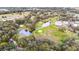 Aerial view of community features including a golf course and pond at 36925 Kiowa Ave, Zephyrhills, FL 33542