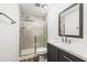 Bathroom boasts a walk-in shower and modern vanity at 36925 Kiowa Ave, Zephyrhills, FL 33542