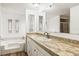 Clean bathroom with updated vanity and tiled flooring at 36925 Kiowa Ave, Zephyrhills, FL 33542
