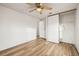 Bedroom with wood-look floors and sliding door closet at 36925 Kiowa Ave, Zephyrhills, FL 33542