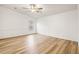 Bedroom with wood-look floors and ceiling fan at 36925 Kiowa Ave, Zephyrhills, FL 33542