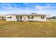 White single-wide manufactured home with covered porch and ramp at 36925 Kiowa Ave, Zephyrhills, FL 33542