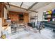 Garage with ample storage shelving and workbench at 36925 Kiowa Ave, Zephyrhills, FL 33542