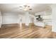 Open kitchen with white cabinets, stainless steel appliances and island at 36925 Kiowa Ave, Zephyrhills, FL 33542