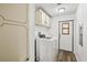 Laundry room with washer, dryer, and extra storage at 36925 Kiowa Ave, Zephyrhills, FL 33542