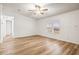 Living room with light flooring, ceiling fan and access to other rooms at 36925 Kiowa Ave, Zephyrhills, FL 33542