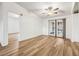 Living area with light flooring and French doors leading to patio at 36925 Kiowa Ave, Zephyrhills, FL 33542