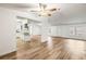 Open concept living room and kitchen with wood-look floors at 36925 Kiowa Ave, Zephyrhills, FL 33542