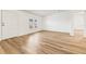 Bright living room with light wood-look flooring and neutral walls at 36925 Kiowa Ave, Zephyrhills, FL 33542