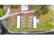 Community shuffleboard courts situated by a pond at 36925 Kiowa Ave, Zephyrhills, FL 33542