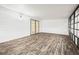 Spacious sunroom, featuring wood-look floors and French doors at 36925 Kiowa Ave, Zephyrhills, FL 33542