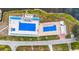 Two swimming pools with lounge chairs and patio area at 36925 Kiowa Ave, Zephyrhills, FL 33542