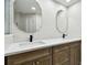 Updated bathroom with double vanity and modern fixtures at 4951 Bacopa S Ln # 401, St Petersburg, FL 33715