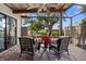 Relaxing screened porch with wicker furniture overlooking the canal at 9386 Tradewinds Ave, Seminole, FL 33776