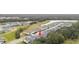 Aerial view showing a house nestled in a community near a lake at 14672 Horse Trot Rd, Lithia, FL 33547