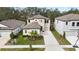 Two-story house with driveway and landscaped lawn, in a residential neighborhood at 14672 Horse Trot Rd, Lithia, FL 33547