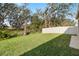 Spacious backyard with a grassy lawn and privacy fence at 14672 Horse Trot Rd, Lithia, FL 33547